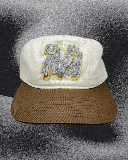 Two-tone ‘Shatter M’ patchwork cap